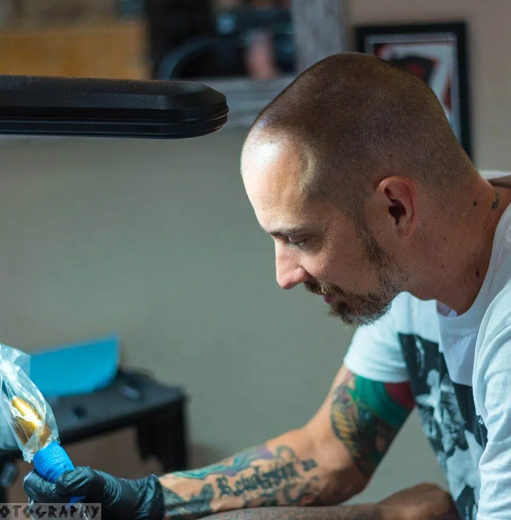Bryan Skolt tattooing a client at Till Death Tattoo Studio in Auburndale